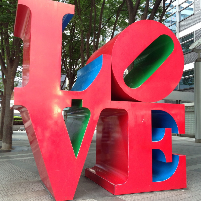outdoors, text, word, building exterior, architecture, plant, art and craft, city, sign, love, day, built structure, letter, alphabet, art, red, no people