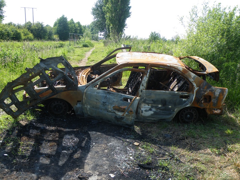 junkyard, steel, car wreck, damaged, outdoors, motor vehicle, wreck, fire, destroyed, arson, car, abandoned, tree, junk, land, automobile, vehicle, ruined