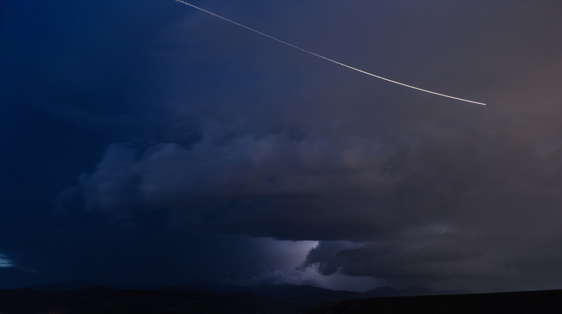 outdoors, science, cloud - sky, dark, nature, low angle view, motion, vapor trail, danger, mode of transportation, falling, dramatic sky, environment, cosmos
