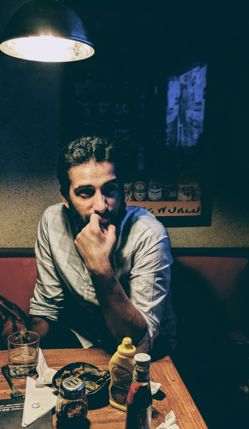 men, leisure activity, nightlife, facial hair, thinking, illuminated, young men, lowlight, real people, young adult, people, 2K, new delhi, waist up, restaurant
