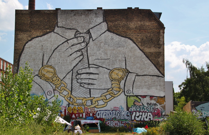district, built structure, hauswand, plant, stones, decay, spirituality, sky, near, mural, building, religion, male likeness, ruin, wall, representation