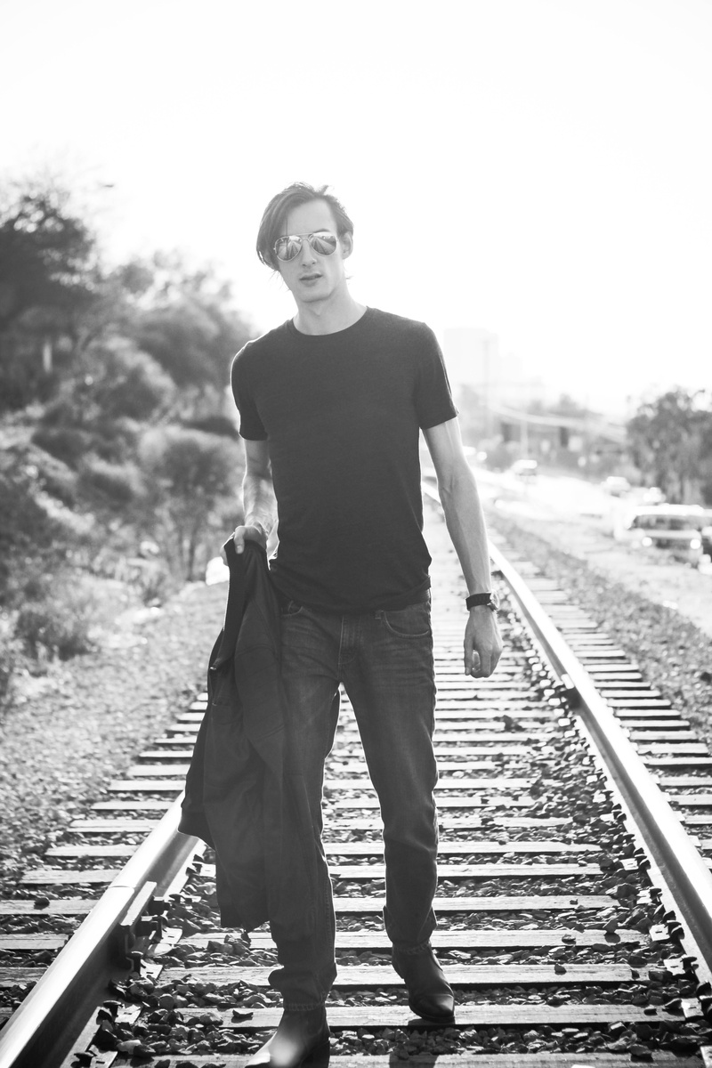 day, mexico, male, young men, leisure activity, rail transportation, one person, transportation, black and white, railroad track, tijuana, full length