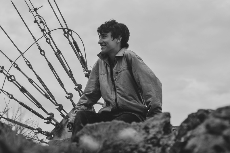 leisure activity, casual clothing, three quarter length, men, side view, sitting, low angle view, horizon, hill, child, day, outdoors, nature, young men