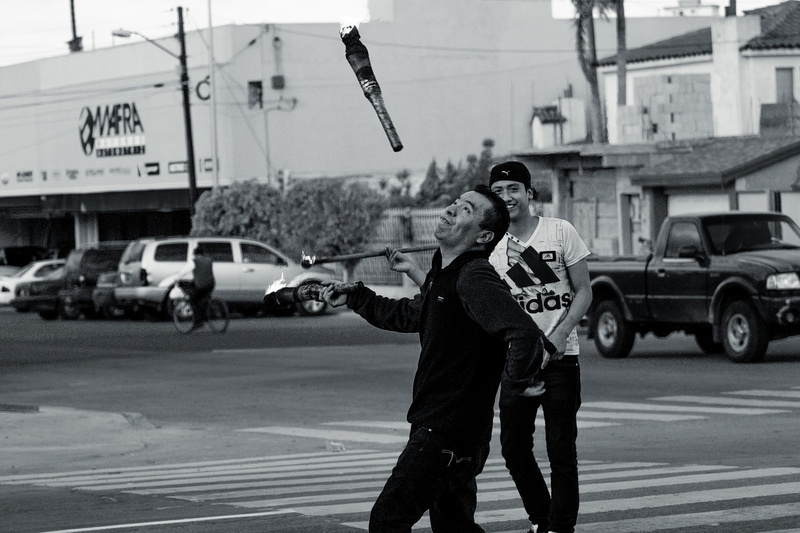mexico, transportation, car, men, clothing, tijuana, real people, architecture, street, young adult, mode of transportation, jugglers, three quarter length