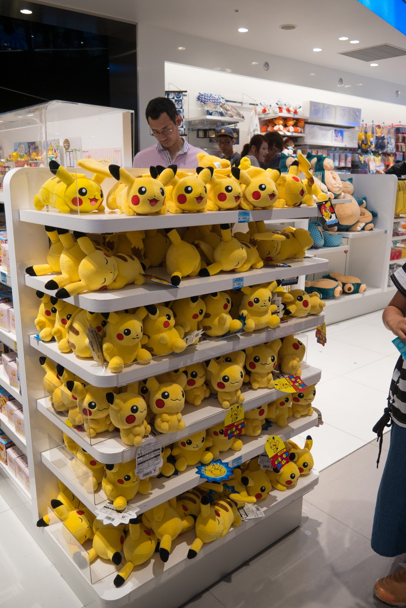 retail, toy, group of people, plywood, human, food, peeps, yellow, indoors, freshness, retail display, men, shop, business, screen, monitor, large group of objects