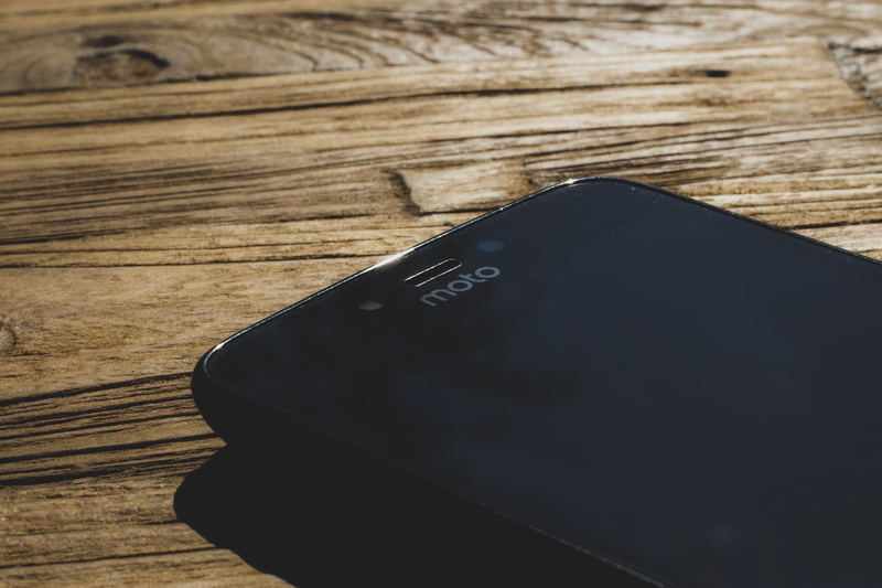 connection, focus on foreground, apps, number, no people, brown, motorola, communication, phone, personal accessory, high angle view, wood, plus, c, mobile