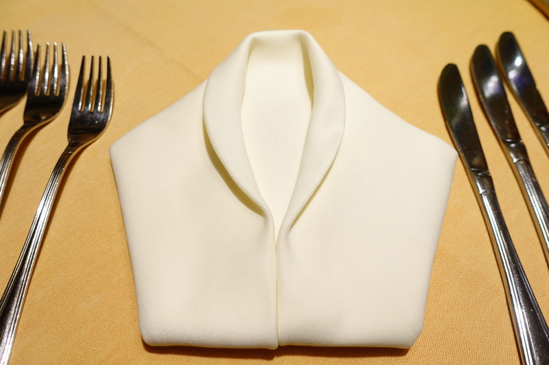 indoors, diner, napkin folding, knife, plate, napkin, table knife, household equipment, silverware, cover, meal, steel, no people, spoon, place setting