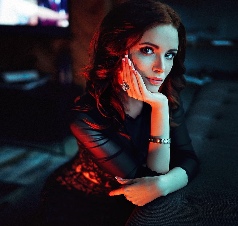 jewelry, dress, wavy hair, rings, painted nails, brunette, shadow, black clothing, red light, 720P, watch, looking at viewer, women, long nails, long hair