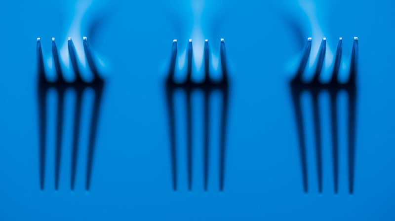 fork, no people, blue background, creativity, household equipment, pattern, studio shot, order, colored background, metal, abstract, close-up, indoors