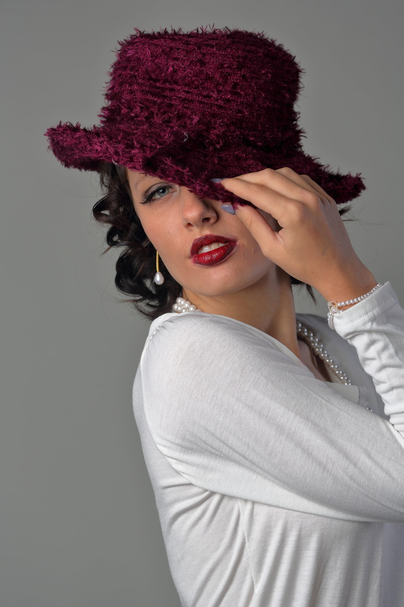 hat, make-up, taking, looking at camera, one person, human body part, white, beautiful people, women, adult, hair, leisure activity, posing, adults only