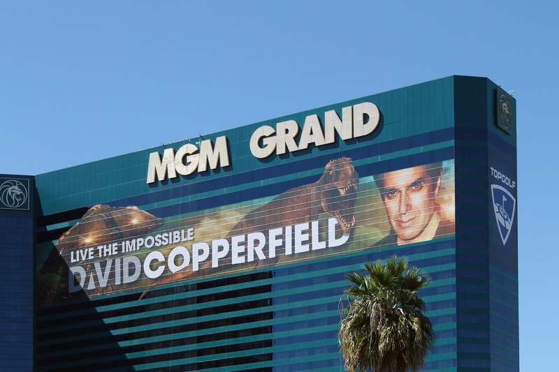 communication, low angle view, guidance, sky, david copperfield, building exterior, western script, casino, station, sign, tree, day, outdoors, transportation