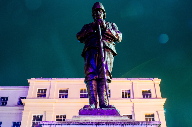 apparel, built structure, spire, sky, sculpture, one person, architecture, helmet, astronaut, metropolis, Statue, building, art, full length, representation