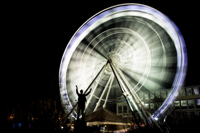human, shape, real people, illuminated, outdoors, iris, theme park, leisure activity, building, arts culture and entertainment, blurred motion, fun, tower