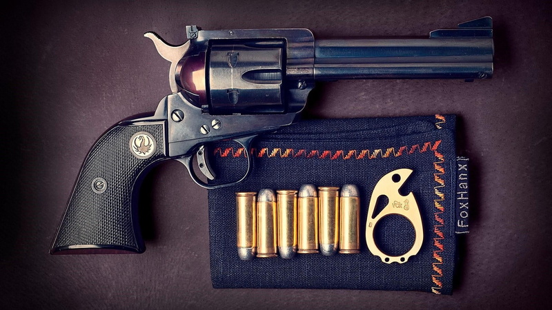 choice, black color, high angle view, gun accessory, metal, gun, no people, warning sign, indoors, aggression, firearm, still life, bullet, trigger, communication