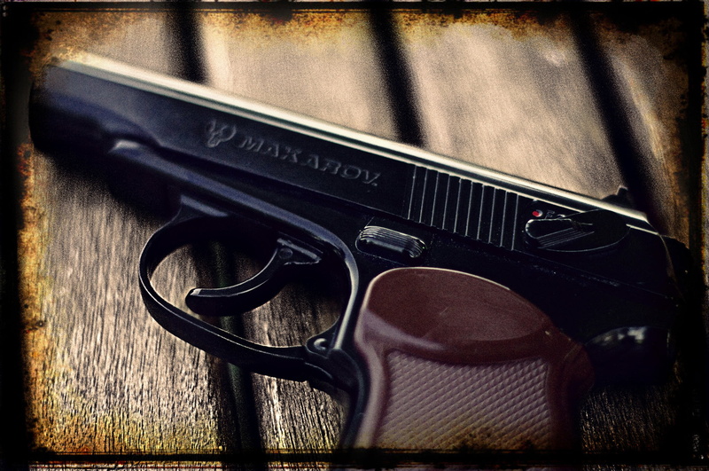 transfer print, arts culture and entertainment, weapon, wood - material, gun, indoors, Makarova, sign, close-up, still life, self-loading, communication
