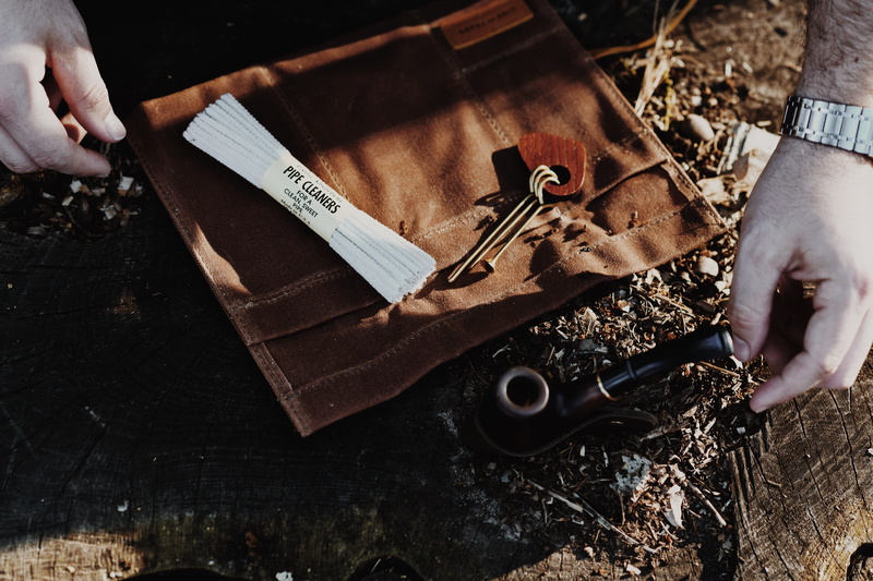 one person, leisure activities, tool, finger, body part, scissors, wallet, indoors, human finger, hand, person, accessory, accessories, weaponry, gun, human