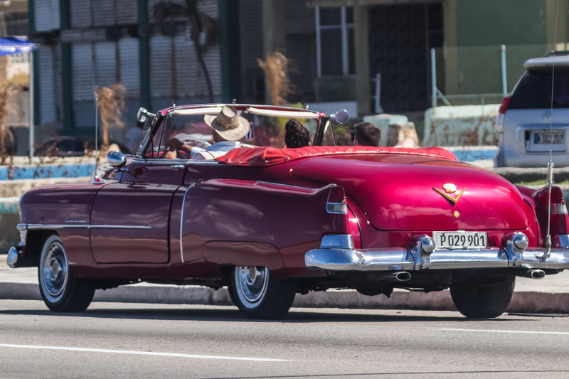 convertible, transportation, built structure, lifestyles, land vehicle, motor vehicle, classic, street, car, cadillac, one person, day, drive, taxi, vehicle
