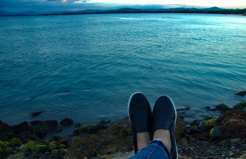 outdoors, human leg, body part, sea, puerto rico, rock, water, malecon de naguabo, low section, land, scenics - nature, shoe, personal perspective, malecon