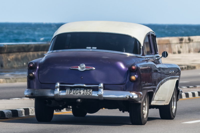 road, outdoors, no people, sunlight, vehicle, retro styled, car, street, buick, purple white, taxi, mode of transportation, sky, architecture, nature, havana