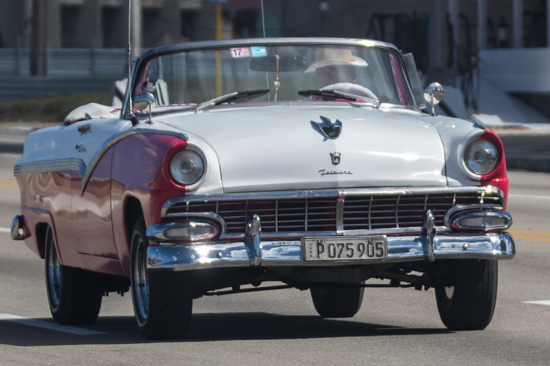 malecon, motor vehicle, havana, architecture, outdoors, sunlight, city, silver colored, car, vintage car, built structure, fairlane, retro styled, headlight