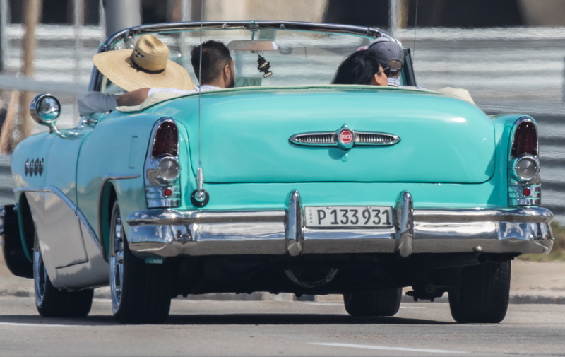 people, sunlight, mode of transportation, headshot, turquoise, togetherness, men, retro styled, leisure activity, taxi, real people, almendron, cuba, day