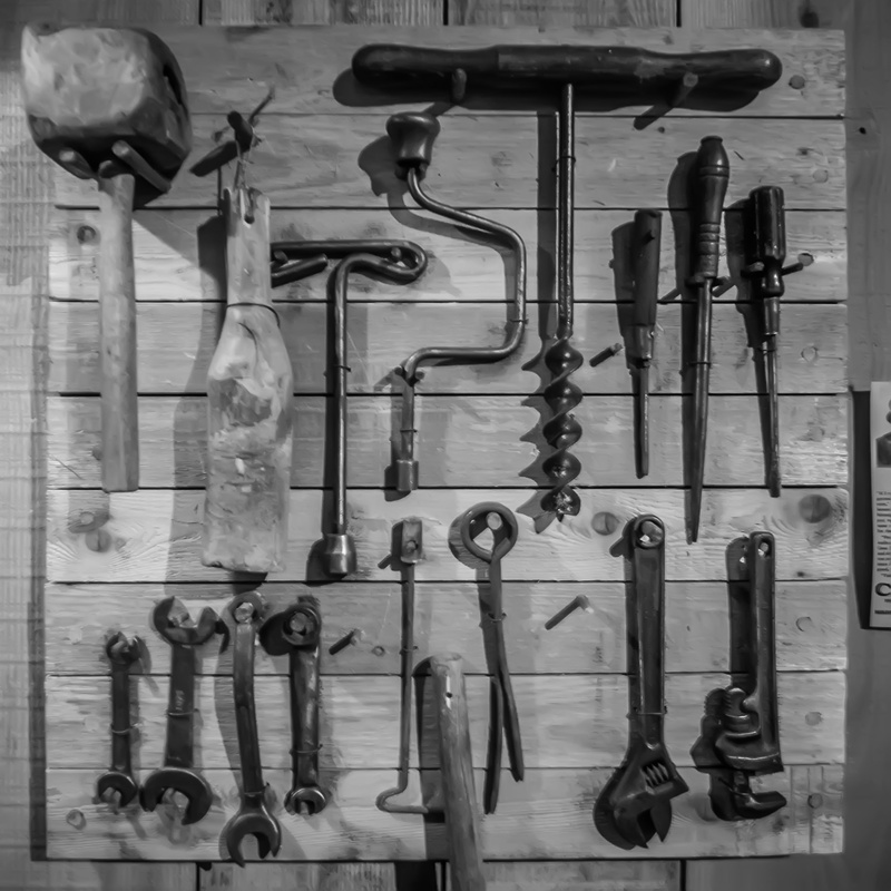 carpentry, chisels, agriculture, box, photography, wall - building feature, hanging, nail, collection, arrangement, messy, work tool, group of objects