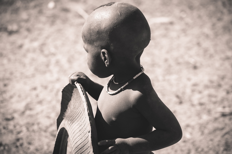 children, childhood, leisure activity, boy, away, tire, photo, grayscale, lifestyles, sunlight, southafrica, baby, child, shirtless, holding, field, namibia