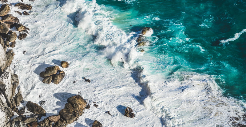 land, aerial, outdoors, bird, high angle view, turquoise colored, beauty in nature, solid, blue, waves, rock, rock - object, sea, crashing, travel, beach