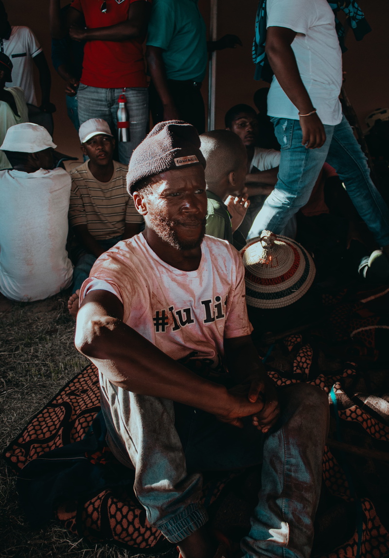 men, rug, south africa, clothing, outdoors, hat, cape town, red, people, basothoblanket, lifestyles, city, pants, market, sothomen, human, day, basothoculture