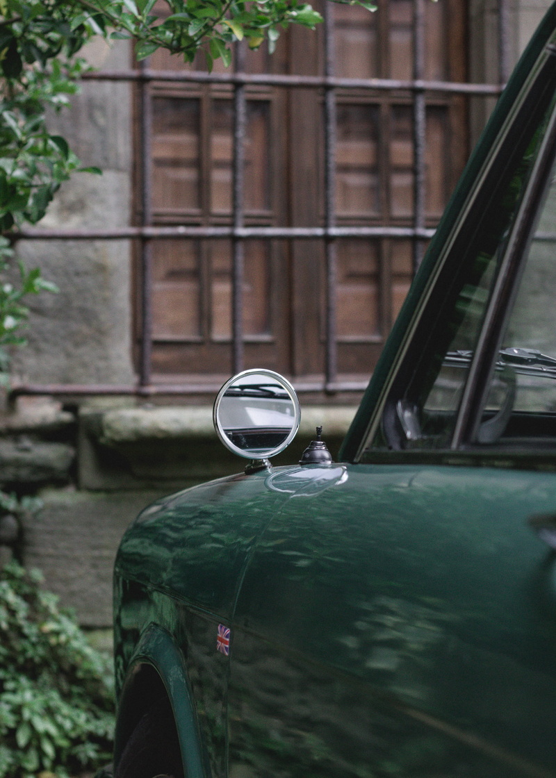 outdoors, architecture, transparent, chrome, view, motor vehicle, gauge, headlight, building, building exterior, symbol, lamp post, mode of transportation