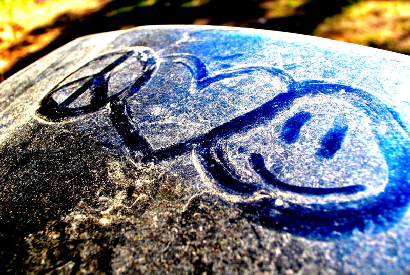drawing, outdoors, blue, carved, shape, stone, sunlight, focus on foreground, no People, circle, ice, textured, smile, peace, creativity, selective focus