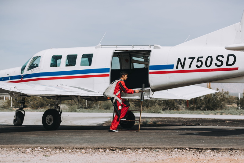 uniform, travel, air, man, mode of transportation, clothing, person, side view, transportation, airplane, landing, plane, adventure, road, human, day, outdoors