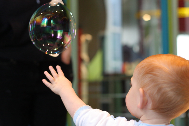 science, vulnerability, offspring, wonder, hand, men, real people, canada, childhood, boy, headshot, child, reaching, 2K, bubble, discovery, focus on foreground
