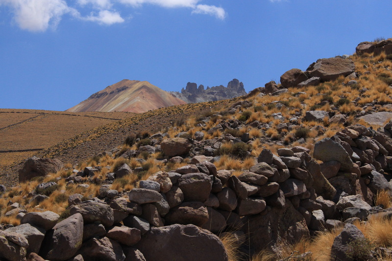 volcano, hiking, beauty in nature, semi-arid, stones, formation, solid, top, arid climate, physical geography, non-urban scene, rock, sky, rock - object