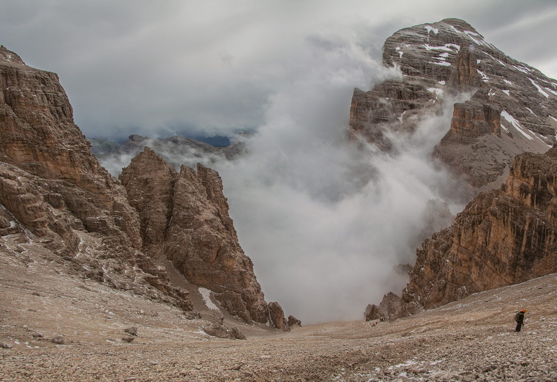 outdoors, slope, smog, landscape, hiker, foggy, rocks, hiking, power in nature, geology, cloudy, scenics - nature, land, descent, steep, cloud - sky, rock