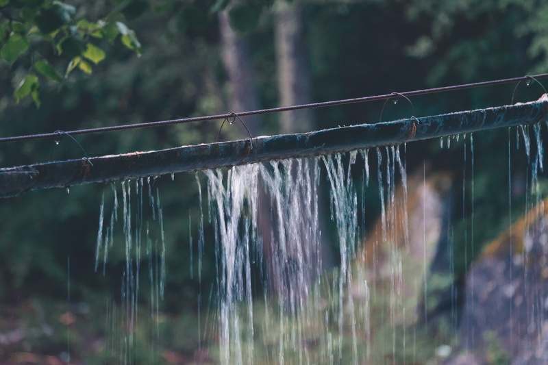 pipe, day, 5K, no people, architecture, tree, water, rain, selective focus, motion, railing, plant, river, drop, built structure, focus on foreground