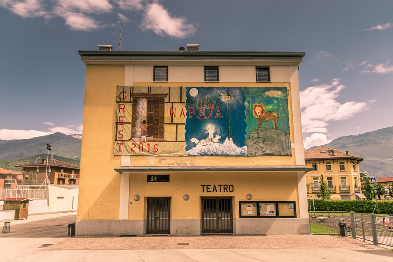 built structure, building exterior, outdoors, art and craft, theatre, text, place, house, sky, sunlight, narnia, cloud - sky, day, mural, representation