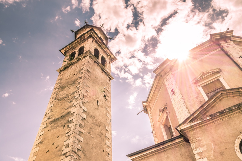 church, travel destinations, tree, no people, spirituality, clock face, sun, building exterior, vacation, reiff, belief, old, europe, low angle view, summer
