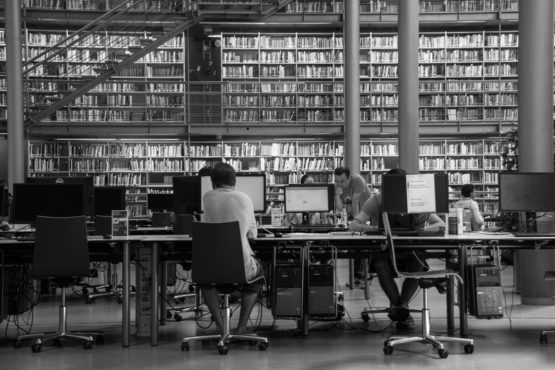 real people, sitting, flat, grayscale, indoors, shelf, bookshelf, screen, education, publication, chair, 4K, men, near, library, business, monitor, women