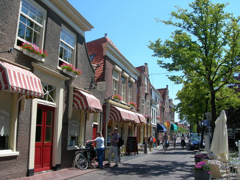 plant, nature, shops, building exterior, real people, city, Delft, architecture, Netherlands, women, day, sky, residential district, house, facade, holland