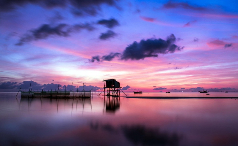 tranquil scene, clouds, silhouette, idyllic, sunset, pink color, reflection, calm, dusk, horizon, architecture, no people, purple, sky, pink, cloud - sky