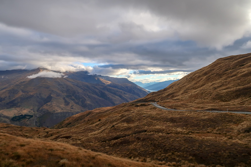 highway, peak, scenics - nature, sky, countryside, beauty in nature, gravel, crown range, day, cloud, physical geography, mountain, road, way, no people