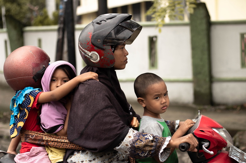 riding, innocence, clothing, helmet, sweater, females, 5K, finger, hardhat, hat, human, day, real people, girls, motorcycle, casual clothing, males, outdoors