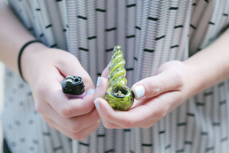 bowl, human hand, adult, drugs, alternative, one person, lifestyles, close-up, small, midsection, day, paraphernalia, treatment, health, lighter, medicine
