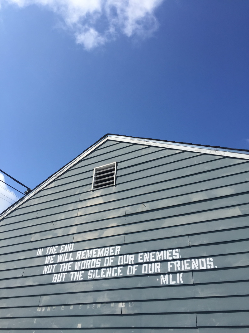 built structure, 2K, clear sky, office building exterior, transportation, western script, sign, nature, text, day, no people, building, mlk, quote, nola