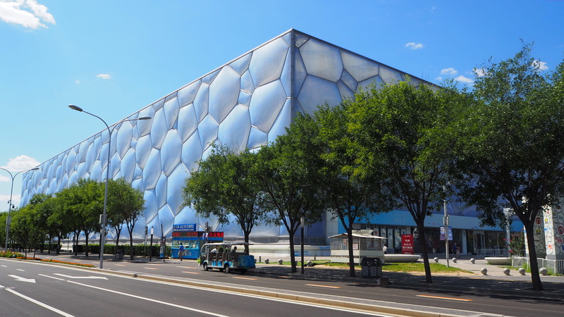 building exterior, beijing, architecture, sunlight, stadium, water cube, blue, no people, road, summer games, growth, tree, modern, olympiad, built structure