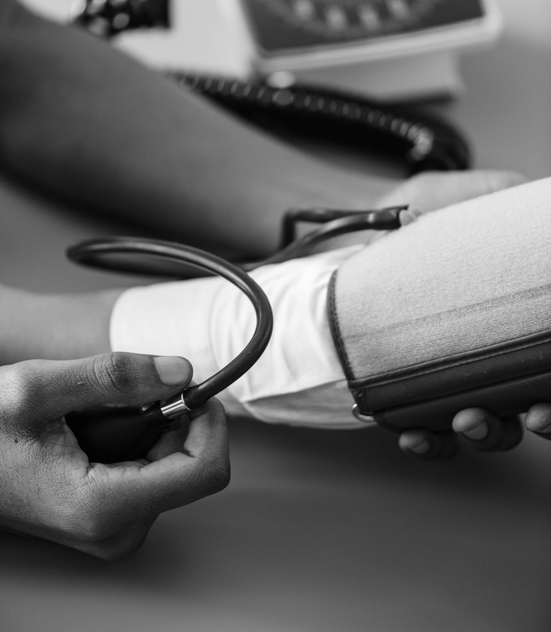 holding, wellness, real people, pressure, adult, grayscale, hand, blood pressure, medical equipment, blood, occupation, table, people, medical supplies