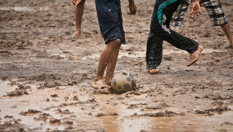 soccer, group of people, team sport, competition, mud, children, human body part, land, playing, dirt, ball, low section, sports equipment, childhood, human leg