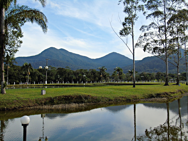 plant, mountain range, lake, scenario, cloud - sky, grass, tranquil scene, holidays, reflection, landscape, mountain, nature, outdoors, beauty in nature
