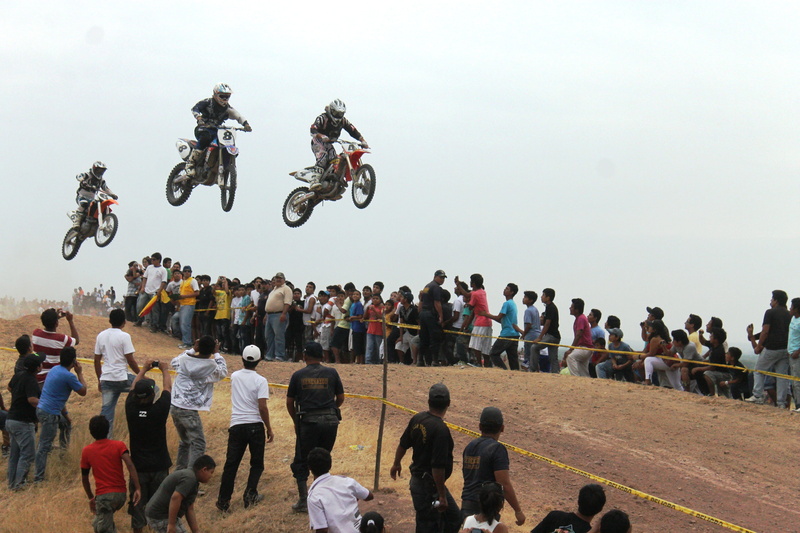 outdoors, real people, three, motion, motorcross, extreme sports, biker, motorbike, riding, crash helmet, sky, motorcycles, race, motocross, spectator